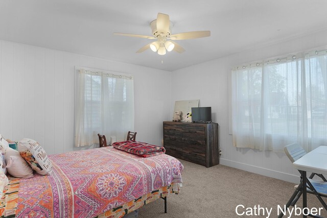 2233 Mills Ave, Muskegon, MI 49445 - carpeted bedroom featuring ceiling fan