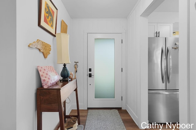 2233 Mills Ave, Muskegon, MI 49445 - entryway featuring dark wood-type flooring and crown molding