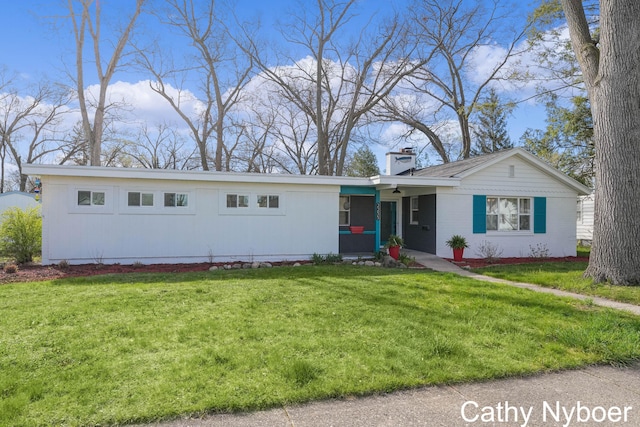 2233 Mills Ave, Muskegon, MI 49445 - ranch-style home with a front lawn and a chimney