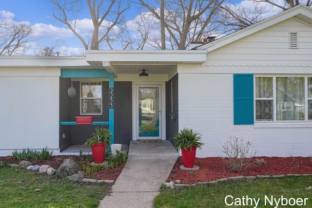 2233 Mills Ave, Muskegon, MI 49445 - property entrance featuring covered porch and brick siding