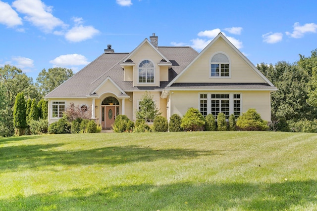 1280 Sylvan Rd, Chelsea, MI 48118 - view of front of house featuring a chimney and a front yard