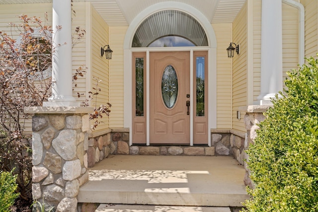 1280 Sylvan Rd, Chelsea, MI 48118 - property entrance featuring stone siding and covered porch