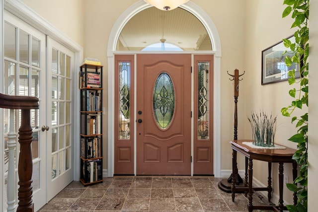 1280 Sylvan Rd, Chelsea, MI 48118 - entryway with baseboards, french doors, and vaulted ceiling