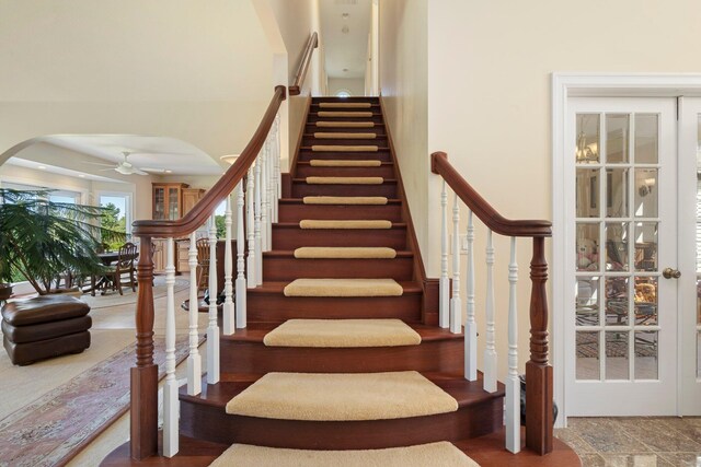 1280 Sylvan Rd, Chelsea, MI 48118 - stairs with a ceiling fan and arched walkways