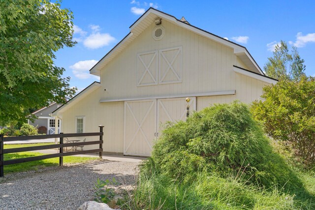 1280 Sylvan Rd, Chelsea, MI 48118 - exterior space with fence, an outdoor structure, and a barn