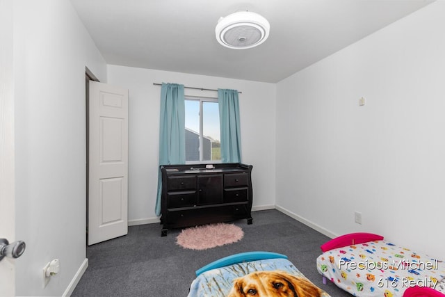 carpeted bedroom with baseboards