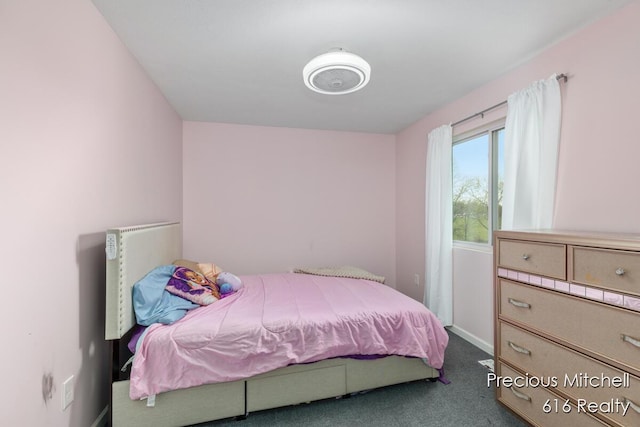 bedroom with carpet and baseboards