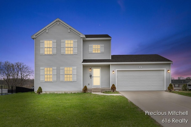 traditional-style home featuring an attached garage, driveway, roof with shingles, and a front yard