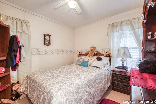 carpeted bedroom with ornamental molding and a ceiling fan