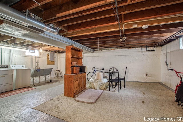 basement with independent washer and dryer and electric panel