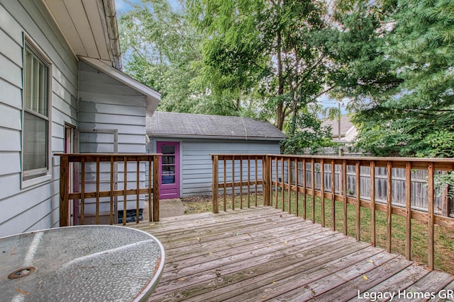 wooden deck featuring a fenced backyard