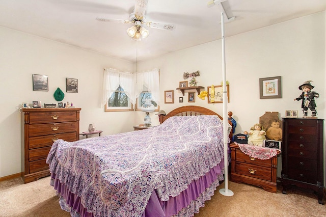 bedroom featuring light colored carpet and ceiling fan