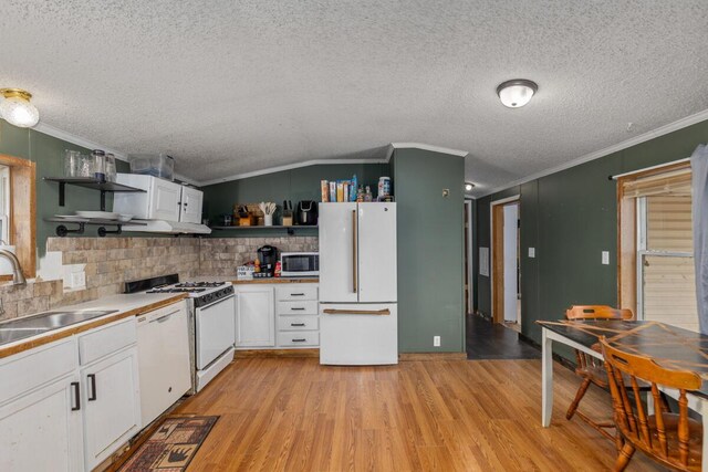 16788 David Ct, Mecosta, MI 49332 - kitchen with ornamental molding, open shelves, a textured ceiling, and white appliances