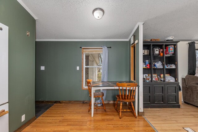 16788 David Ct, Mecosta, MI 49332 - interior space with wood finished floors, a textured ceiling, and crown molding
