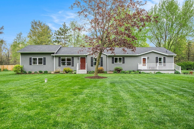 53746 Stevens Ln, Three Rivers, MI 49093 - view of front facade featuring a front lawn, a deck, and roof with shingles