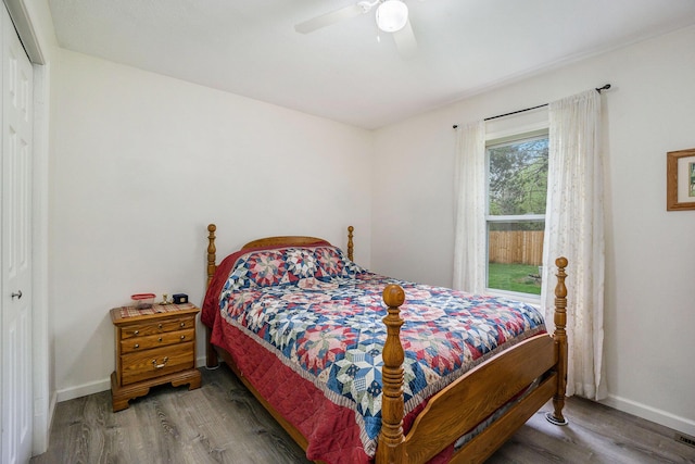 53746 Stevens Ln, Three Rivers, MI 49093 - bedroom featuring a closet, wood finished floors, baseboards, and a ceiling fan