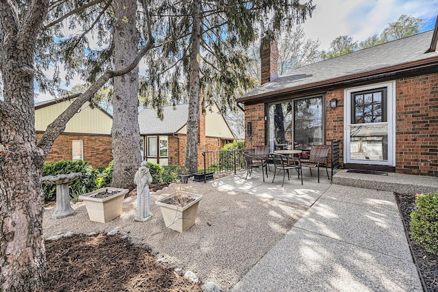 view of patio / terrace with an outdoor fire pit