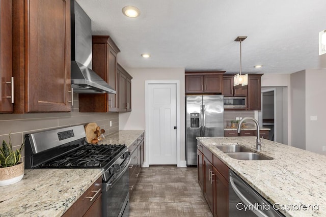 11325 Wake Dr, Allendale, MI 49401 - kitchen with wall chimney range hood, backsplash, light stone countertops, a sink, and stainless steel appliances
