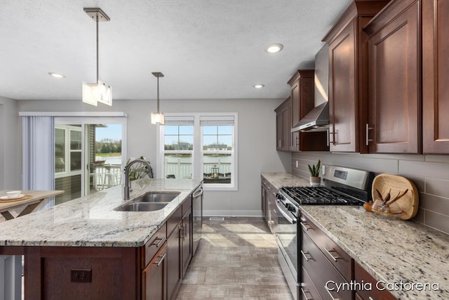 11325 Wake Dr, Allendale, MI 49401 - kitchen with wall chimney range hood, a sink, baseboards, stainless steel appliances, and recessed lighting