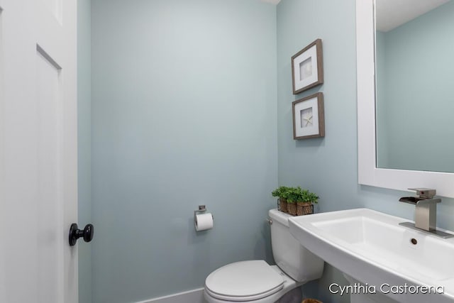 11325 Wake Dr, Allendale, MI 49401 - half bathroom featuring a sink and toilet