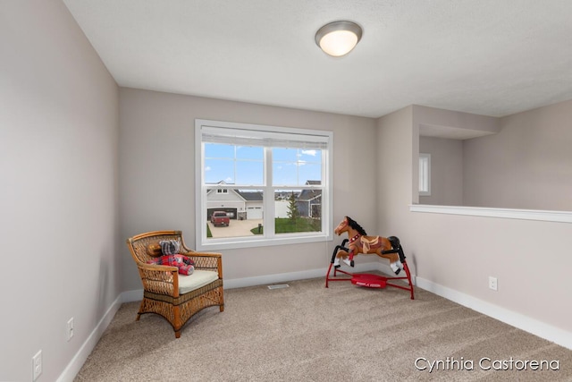 11325 Wake Dr, Allendale, MI 49401 - living area with baseboards, visible vents, and carpet