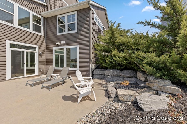 11325 Wake Dr, Allendale, MI 49401 - view of patio featuring a fire pit
