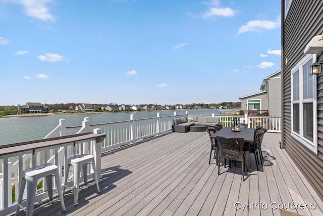 11325 Wake Dr, Allendale, MI 49401 - wooden deck featuring a water view, an outdoor living space, and outdoor dining area