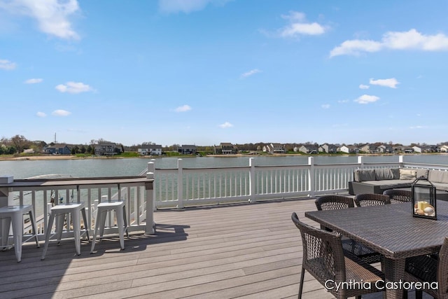 11325 Wake Dr, Allendale, MI 49401 - wooden deck with outdoor dining area and a water view