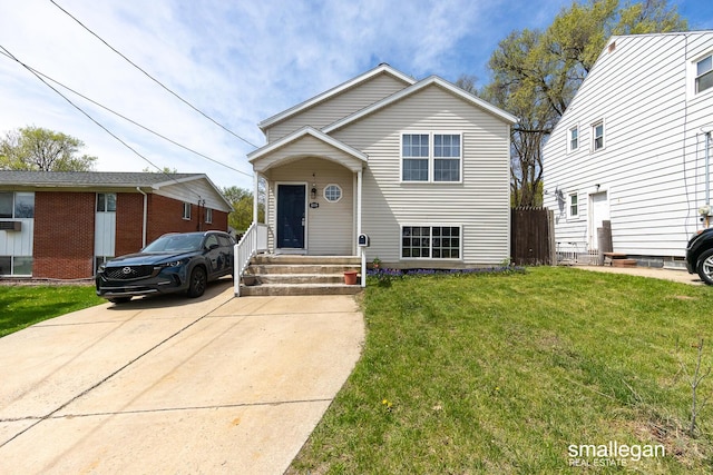 tri-level home with a front yard