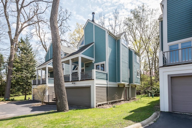 285 Mulholland Ave, Ann Arbor, MI 48103 - view of property exterior with a garage, driveway, and a yard