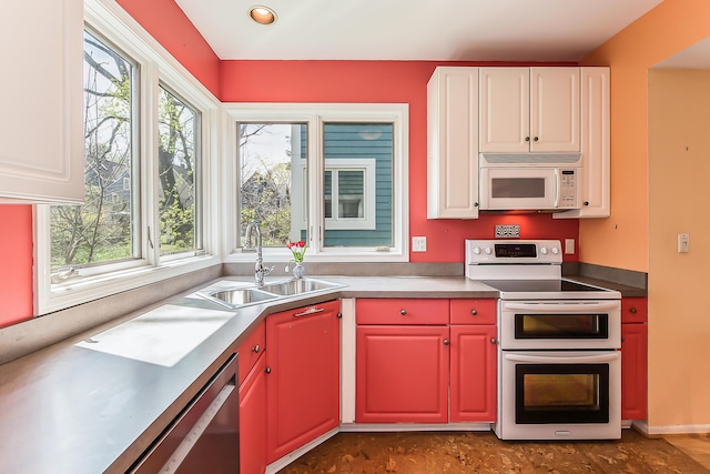 285 Mulholland Ave, Ann Arbor, MI 48103 - kitchen featuring a healthy amount of sunlight, white appliances, white cabinetry, and a sink