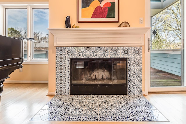 285 Mulholland Ave, Ann Arbor, MI 48103 - interior details featuring baseboards, wood finished floors, and a fireplace