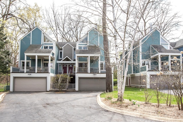 285 Mulholland Ave, Ann Arbor, MI 48103 - view of front facade with roof with shingles, a garage, and aphalt driveway