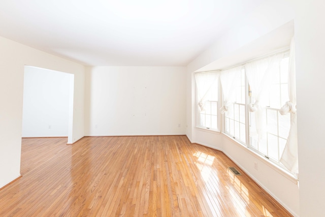3126 Fairhaven Ct, Ann Arbor, MI 48105 - spare room featuring baseboards, visible vents, and light wood-style floors
