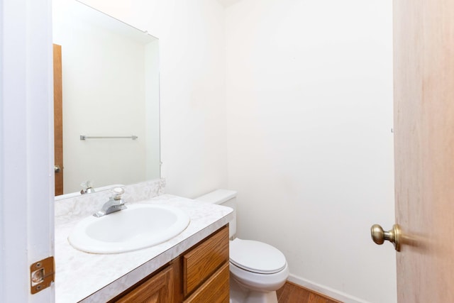 3126 Fairhaven Ct, Ann Arbor, MI 48105 - bathroom featuring vanity, baseboards, toilet, and wood finished floors