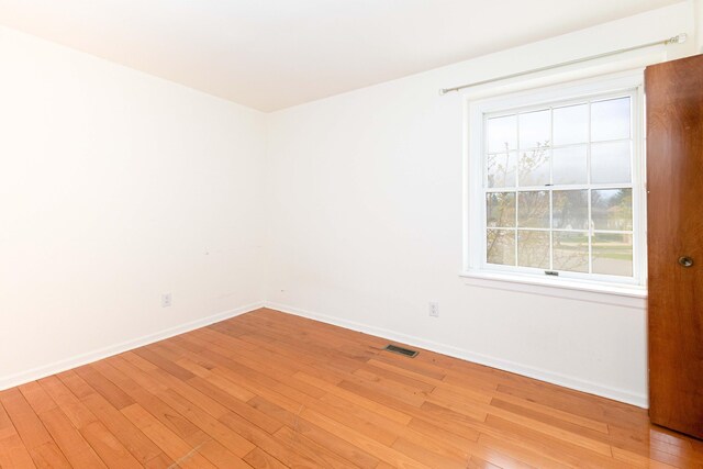 3126 Fairhaven Ct, Ann Arbor, MI 48105 - unfurnished room featuring visible vents, light wood finished floors, and baseboards
