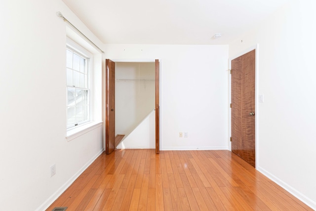 3126 Fairhaven Ct, Ann Arbor, MI 48105 - unfurnished bedroom featuring baseboards, light wood finished floors, and a closet