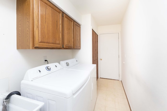 3126 Fairhaven Ct, Ann Arbor, MI 48105 - laundry room with a sink, separate washer and dryer, cabinet space, and light floors
