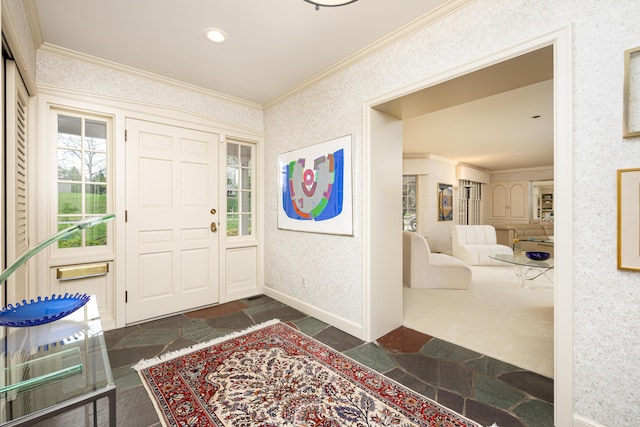 1060 Chestnut St, Ann Arbor, MI 48104 - foyer entrance featuring stone finish floor, ornamental molding, wallpapered walls, and baseboards