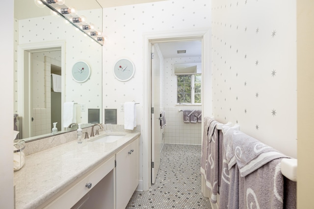 1060 Chestnut St, Ann Arbor, MI 48104 - bathroom featuring tile patterned floors, wallpapered walls, and vanity