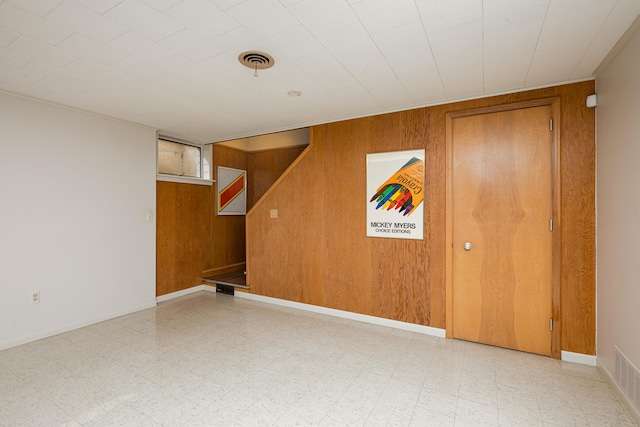 1060 Chestnut St, Ann Arbor, MI 48104 - below grade area featuring wood walls and tile patterned floors