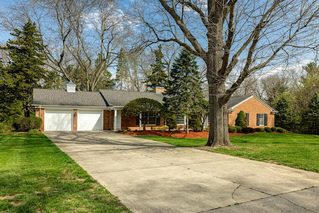 1060 Chestnut St, Ann Arbor, MI 48104 - ranch-style home with a front lawn, brick siding, a chimney, concrete driveway, and an attached garage