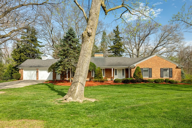 1060 Chestnut St, Ann Arbor, MI 48104 - single story home featuring brick siding, a front lawn, and concrete driveway