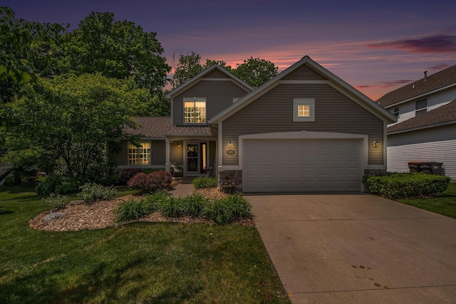 5591 E Grove Dr SE, Grand Rapids, MI 49512 - traditional-style house featuring concrete driveway, a front lawn, and an attached garage