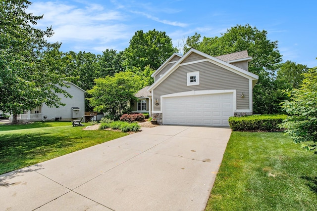 5591 E Grove Dr SE, Grand Rapids, MI 49512 - traditional home featuring stone siding, driveway, a front lawn, and a garage