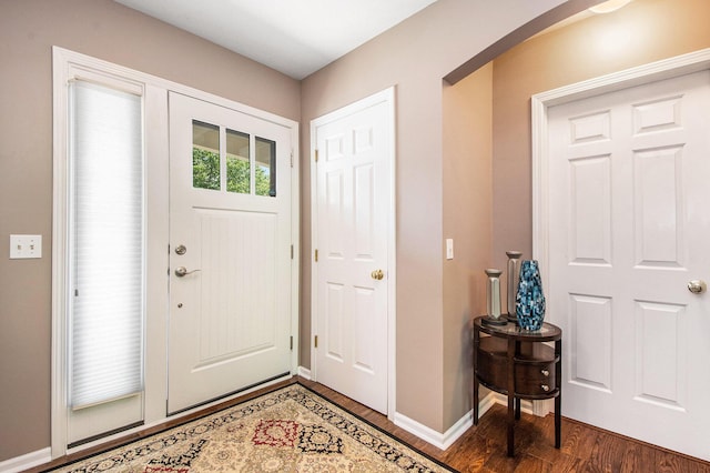 5591 E Grove Dr SE, Grand Rapids, MI 49512 - foyer entrance with wood finished floors and arched walkways