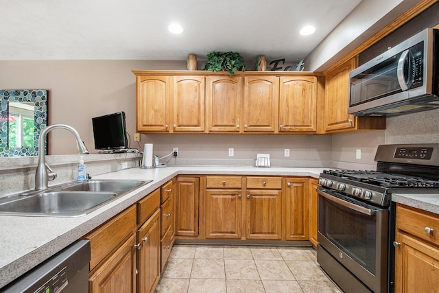 5591 E Grove Dr SE, Grand Rapids, MI 49512 - kitchen featuring appliances with stainless steel finishes, light countertops, light tile patterned floors, recessed lighting, and brown cabinets