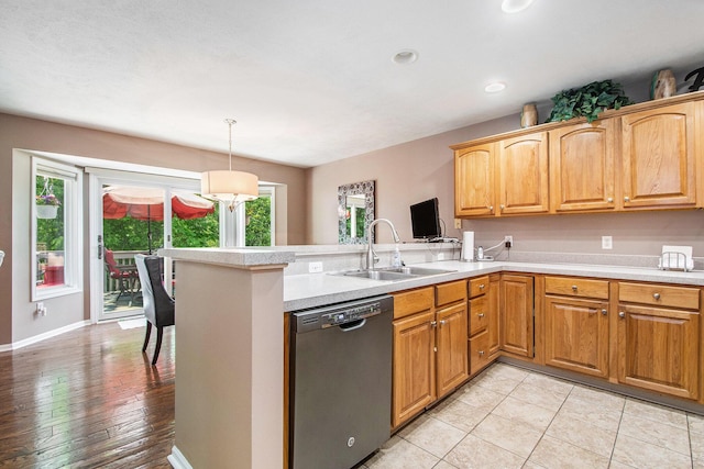 5591 E Grove Dr SE, Grand Rapids, MI 49512 - kitchen with dishwasher, plenty of natural light, a peninsula, light countertops, and recessed lighting