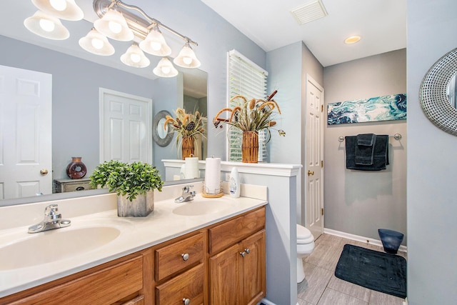 5591 E Grove Dr SE, Grand Rapids, MI 49512 - full bath with toilet and double vanity