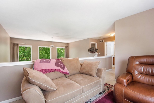 5591 E Grove Dr SE, Grand Rapids, MI 49512 - living room featuring light carpet and baseboards